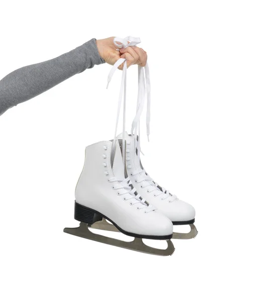 Hand with thumb up sign holding woman ice skates — Stock Photo, Image