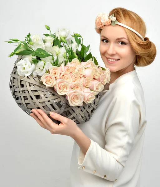 Beautiful woman with pastel color bouquet of wild white roses fl — Stock Photo, Image