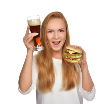 Fast food concept. Woman hold tasty unhealthy burger sandwich