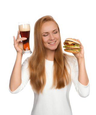 Fast food concept. Woman hold tasty unhealthy burger sandwich in