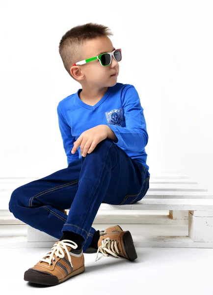 Fashion beautiful little boy in italy sunglasses blue cloth jean — Zdjęcie stockowe