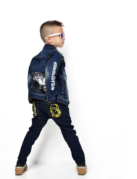 Fashion beautiful little boy standing standing backward rear vie — Zdjęcie stockowe