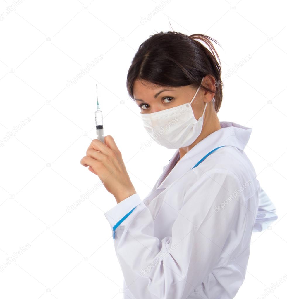Doctor or nurse with syringe needle for flu injection vaccinatio
