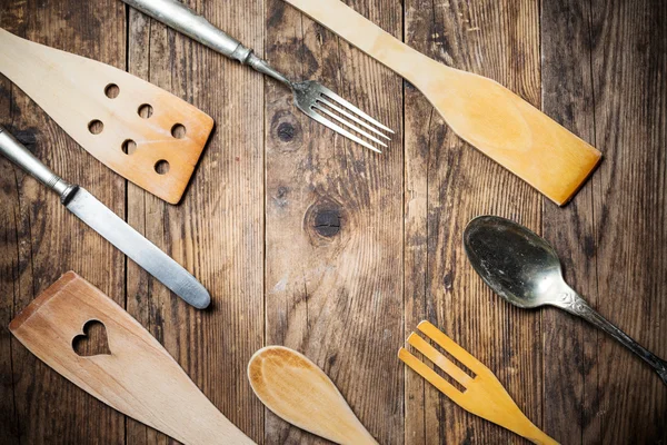 Wood and metal utensils, wooden table. — Stock Photo, Image