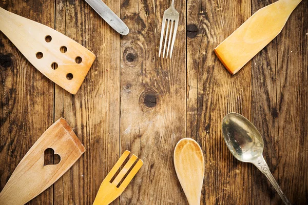 Wood and metal utensils, wooden table. — Stock Photo, Image