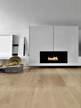 interior view of a modern living room with wood floor  in foreground the fireplace clipart