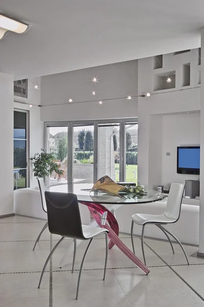 Glass dining table in the modern living room — Stock Photo, Image