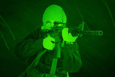East Islamic rebel with assault rifle. View through night vision scope. clipart