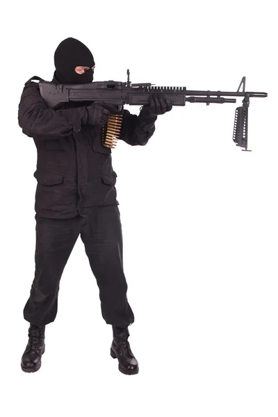 Mercenary in black uniforms with machine gun — Stock Photo, Image