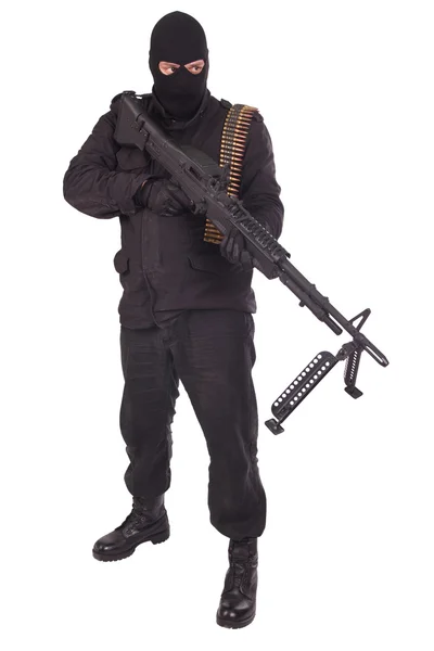 Mercenary in black uniforms with machine gun — Stock Photo, Image