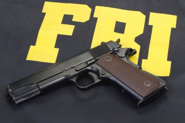 M1911 handgun with ammo clipart