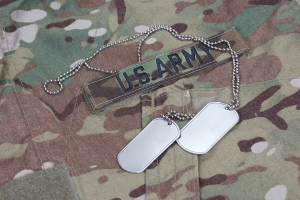 Us army camouflaged uniform with blank dog tags — Stock Photo, Image