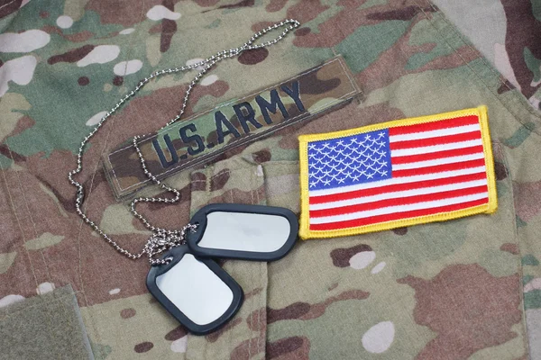 Us army camouflaged uniform with US flag patch and blank dog tags — Stock Photo, Image