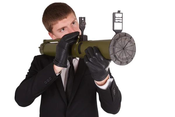 Man in black costume and bazooka — Stock Photo, Image