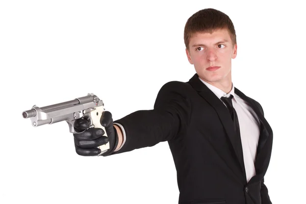 Man in black costume and handgun — Stock Photo, Image