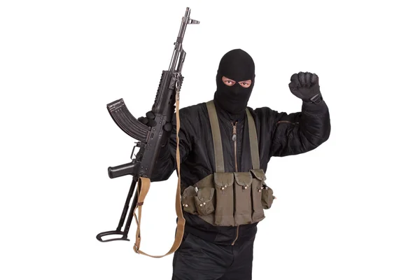 Insurgent in black uniform with kalashnikov — Stock Photo, Image