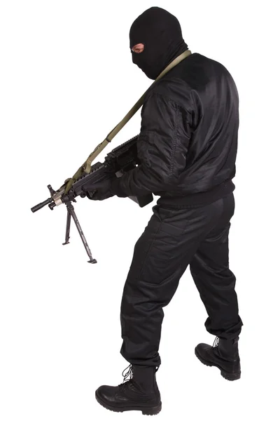 Insurgent in black uniform and mask with machine gun — Stock Photo, Image