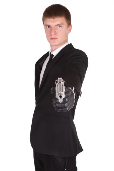 Man in black suit and handgun — Stock Photo, Image