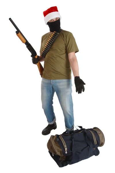 Robber in cap of Santa Claus with shotgun — Stock Photo, Image