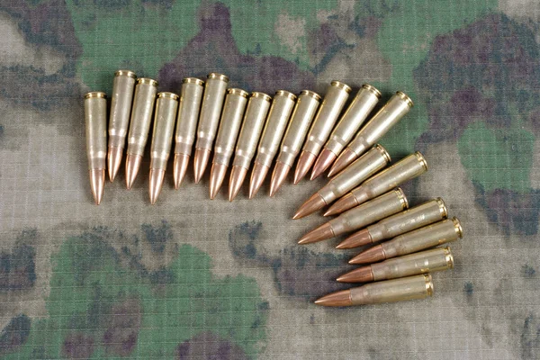 Cartridges on camouflage uniform — Stock Photo, Image