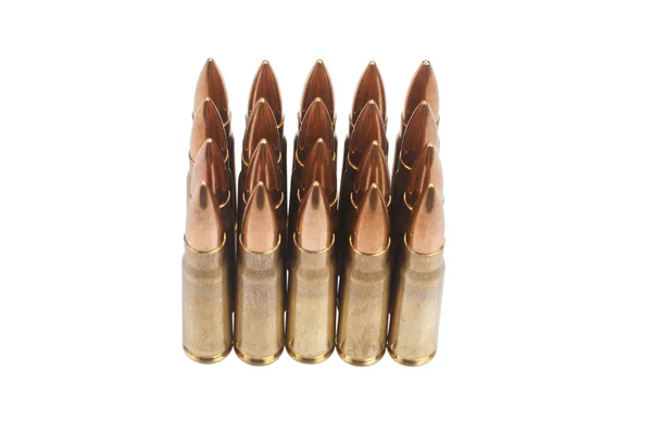 Kalashnikov cartridges on white background Royalty Free Stock Photos
