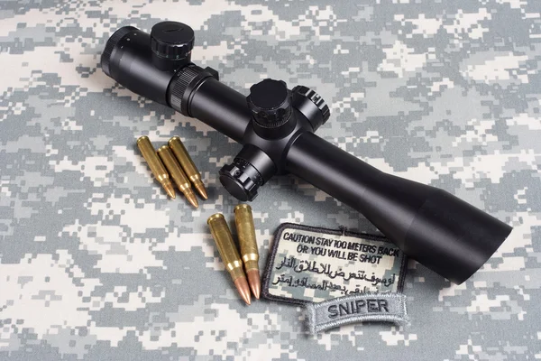 Sniper scope and insignia and bullets — Stock Photo, Image
