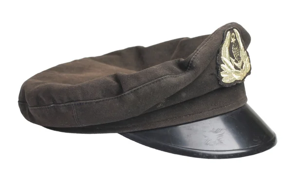 Старая черная шапочка с эмблемой — стоковое фото