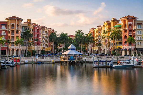 Naples, Florida, USA downtown cityscape on the bay at dusk.