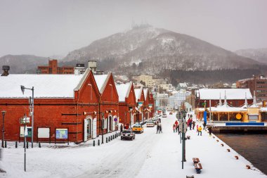 Hakodate, Hokkaido, Japan at the historic shops and restaurants of the Kanemori on a winter evening. clipart