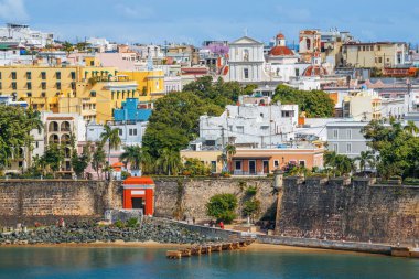 Old San Juan, Puerto Rico cityscape on the water in the Caribbean. clipart