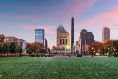 Indianapolis, Indiana, USA war memorials and skyline at twilight. clipart
