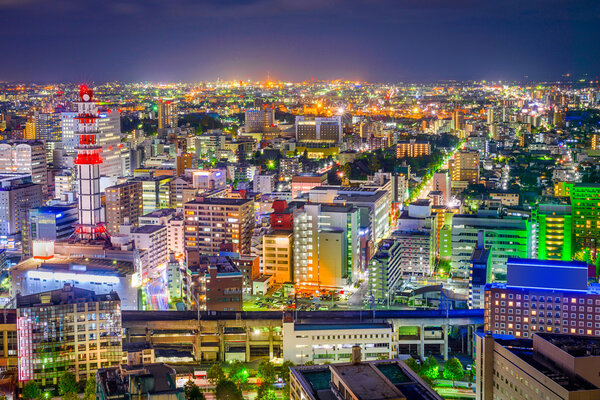 Sendai, Japan downtown city skyline looking towards the main station at night.