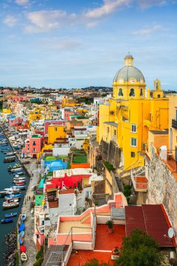 Procida, Italy old town skyline in the Mediterranean Sea during dusk.