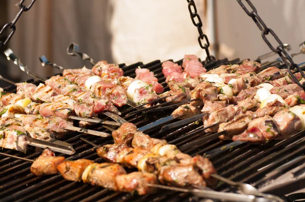 Roasting meat on grill — Stock Photo, Image