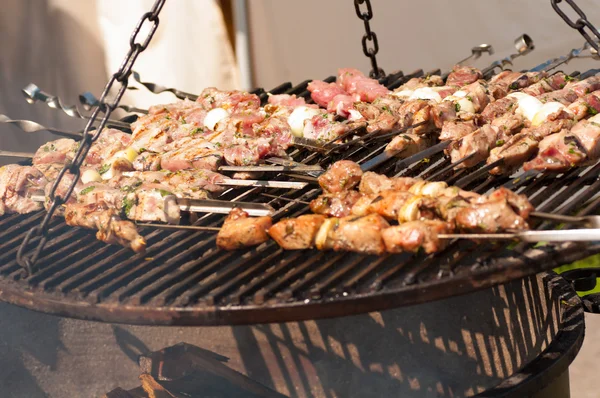 Roasting meat on grill — Stock Photo, Image