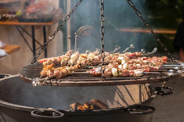 Roasting meat on grill — Stock Photo, Image