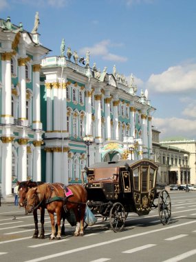 carriage with horses near the palace of the Hermitage Museum in St. Petersburg clipart