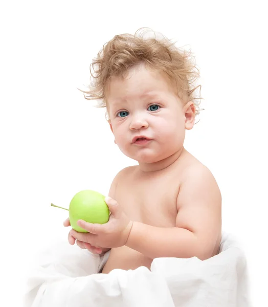 Piccolo bambino con la testa riccia che tiene la mela — Foto Stock