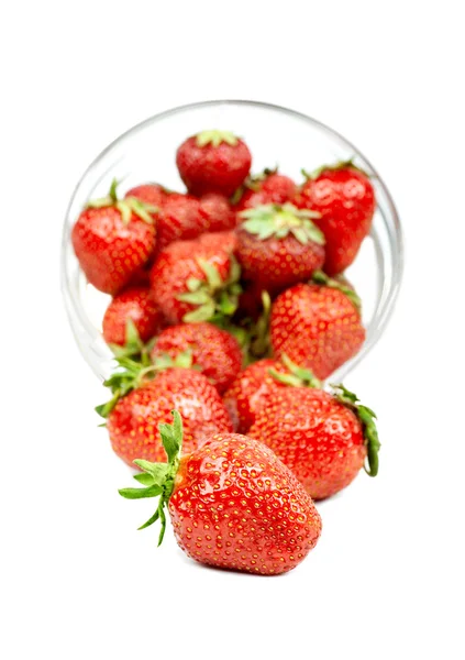 Strawberry trickling through the  plate — Stock Photo, Image