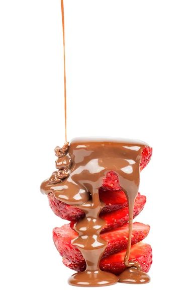 Pouring chocolate on strawberry slices — Stock Photo, Image