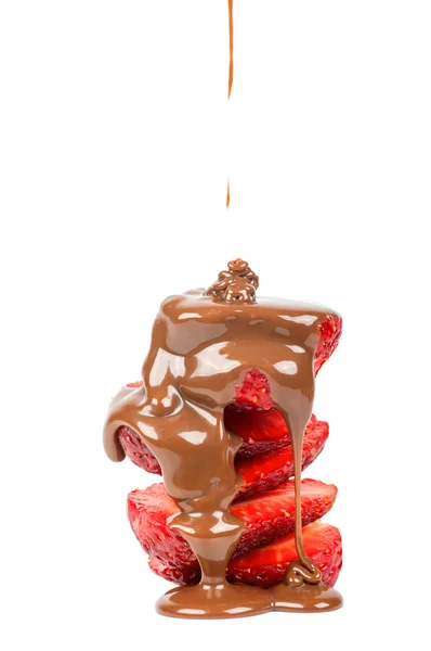 Pouring chocolate on strawberry slices — Stock Photo, Image