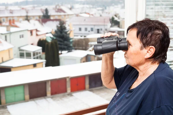 Senior woman with binoculars — Stock Photo, Image