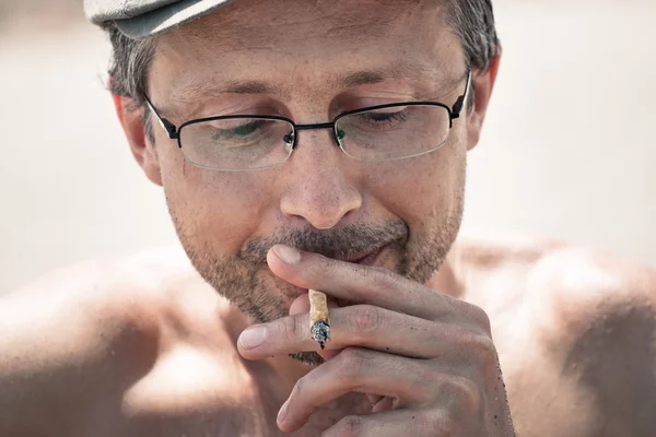 Man smoking hashish joint — Stock Photo, Image