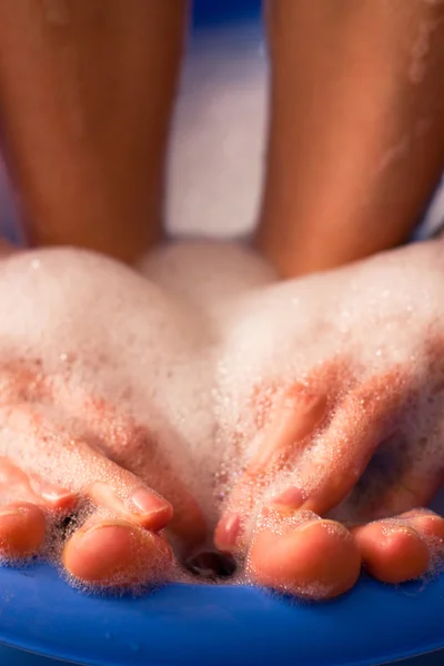 Female feet in soap bath — Stock Photo, Image