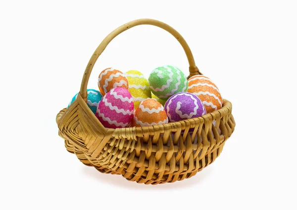 Easter basket with eggs over white — Stock Photo, Image