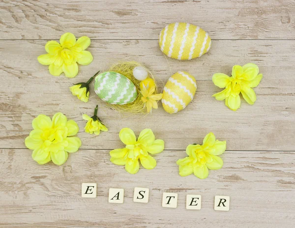 Inscription with Easter colored eggs — Stock Photo, Image