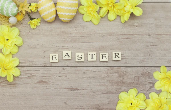 Inscription with Easter colored eggs — Stock Photo, Image