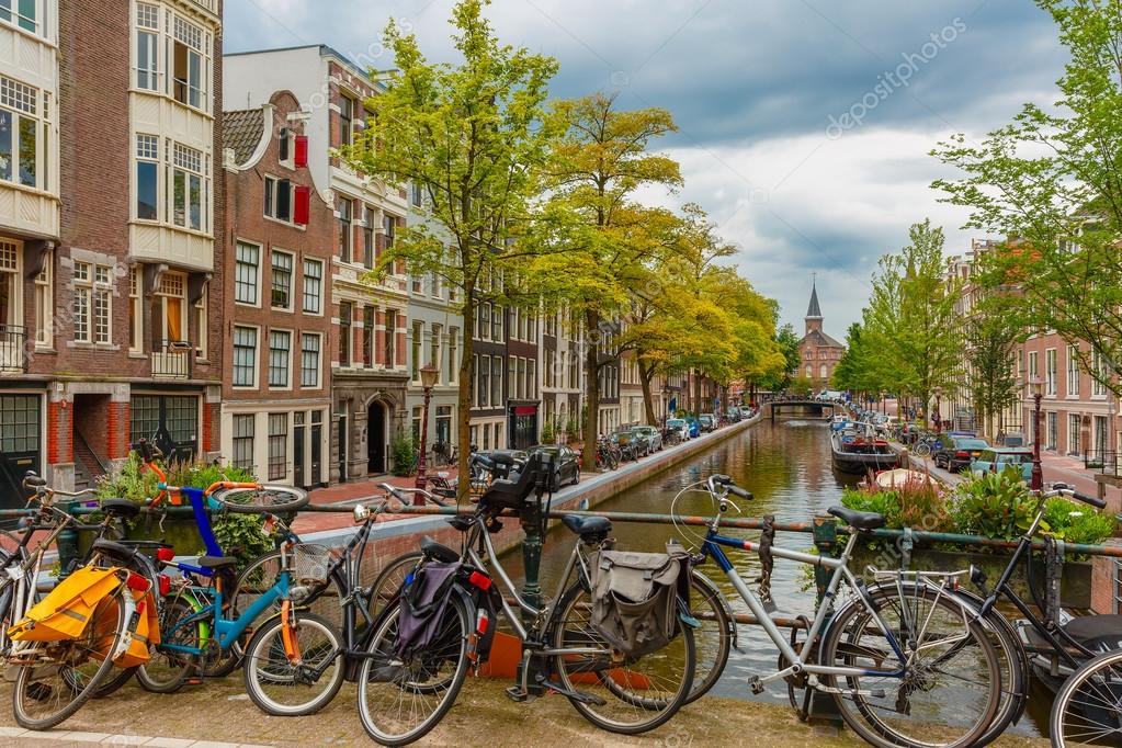 Amsterdam Canal And Bridge With Bikes Holland Netherlands
