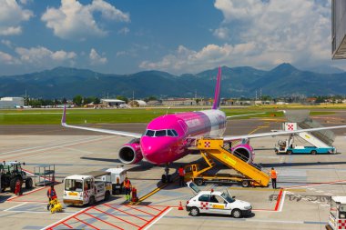 Preparation of aircraft Wizzair in Bergamo to fly  clipart