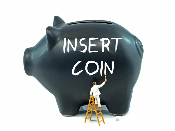 Insert Coin on Piggy Bank — Stock Photo, Image